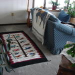 Floor rug from Mexico, throw from Mexico, gift from Danny Bronson.