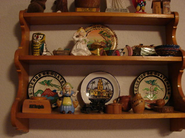 Dale made the shelf.  The dutch girl, the ring holder, the canoe and the salt and pepper shakers were bought on the trip to Cali