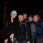 Can you believe we're all standing in front of the Eiffel Tower in Paris?