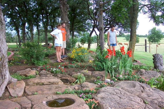 The neighbors, Lori and Robby, stop by to admire the garden.