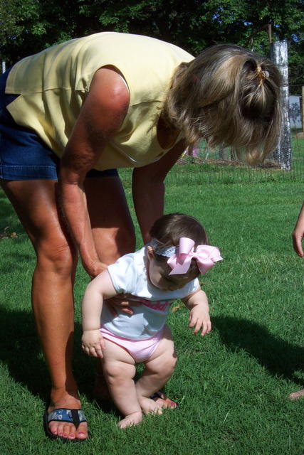 Judy is teaching Kylie to walk.  It's the first time Kylie has touched grass!