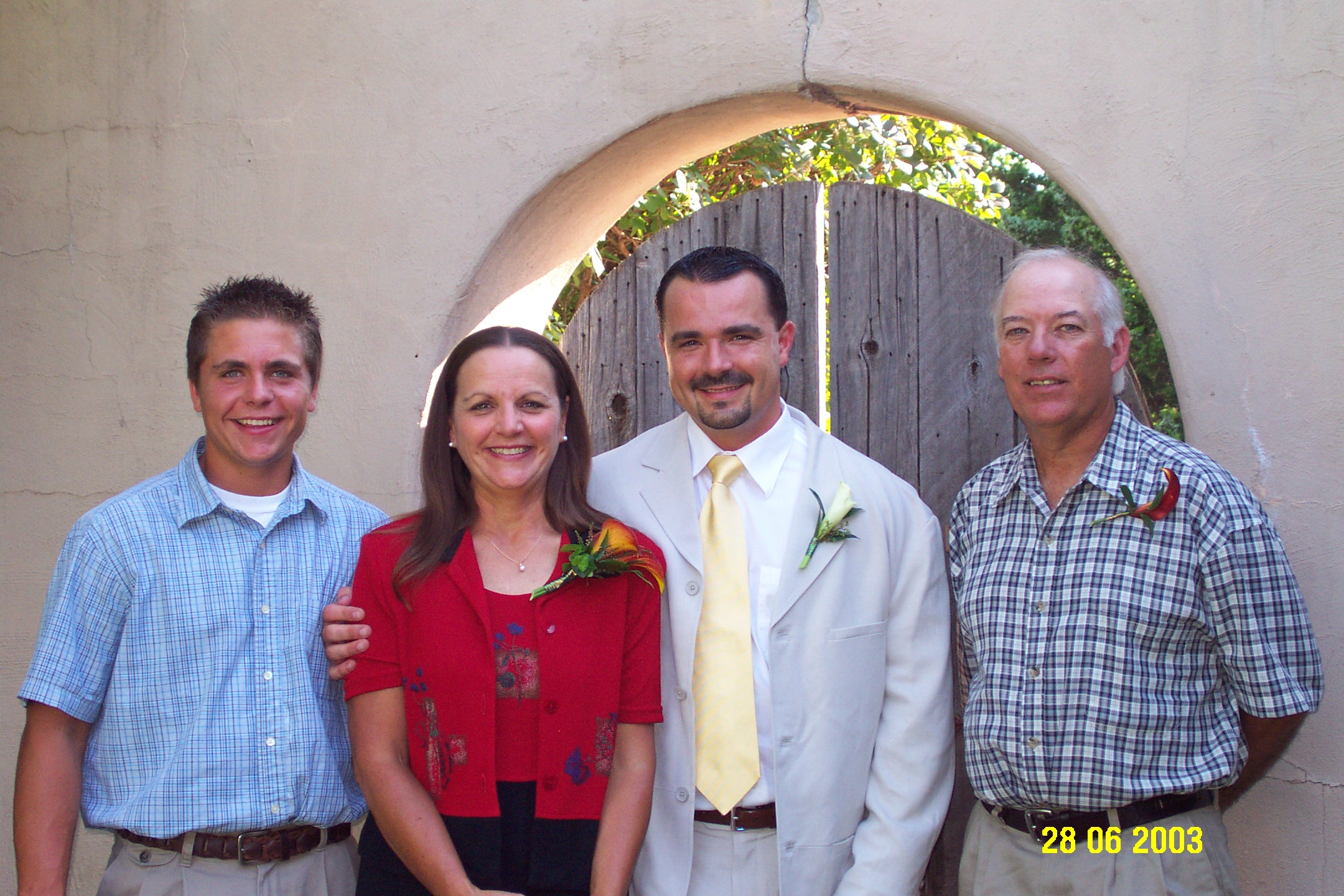 Brad with his brother Scott, his mother Donna and her husband Ron