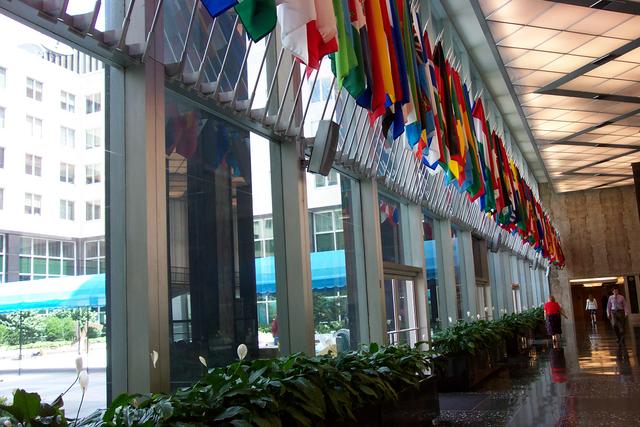As you enter the State Department lobby, you see all these flags from around the world.