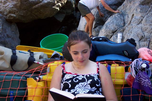 Sara chose to stay in the boat and read.