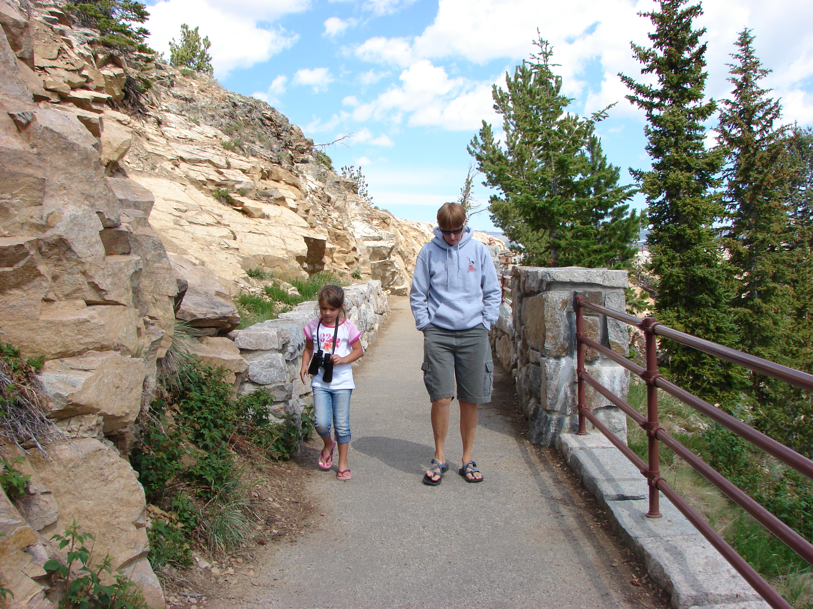 Linda W and Conli walk back from the vista.