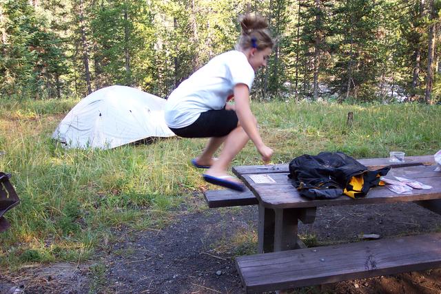 Lindsay can jump from the ground and land on top of the table.