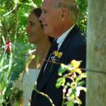 The bride is escorted in by her father.