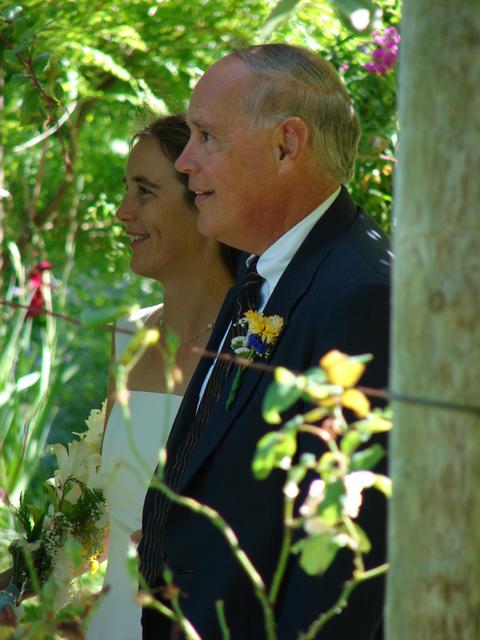 The bride is escorted in by her father.