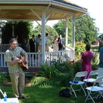 Mike plays "Brown-eyed Girl" as Lindsay enters.