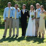 The bridal party poses for pictures.