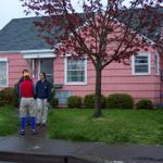 Lindsay, Ben and Linda W in front of the house.