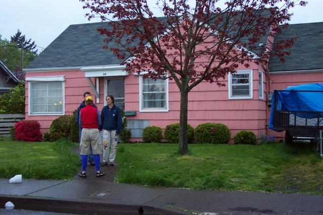 Lindsay, Ben and Linda W in front of the house.