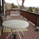 Deck with swing that was a birthday present from JJ and kids.  Two chairs bought at Billings Hardware.