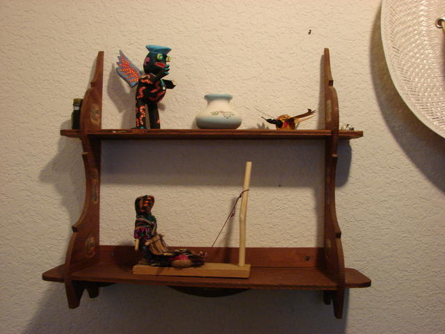 Shelf may have been bought in Mexico when Dad took us on a trip to California when I was about 10.  Little pot may have been bou