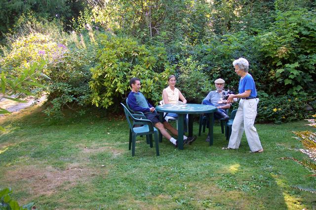 Judy brings out food!  What a lovely place for dinner.