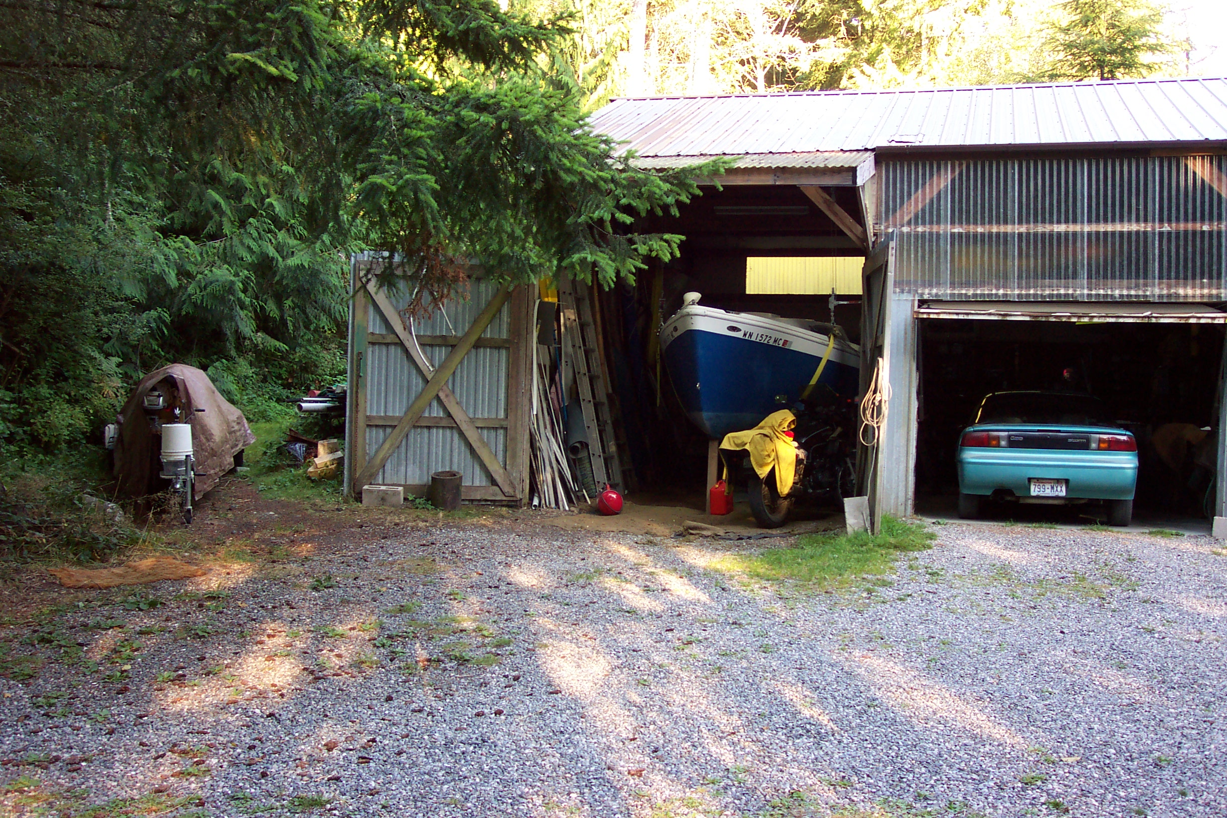 In the shop is another sailboat and to the left is the trimaran that Rob sails.