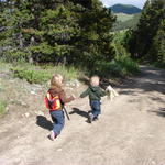 June and Matteo run down the trail.