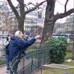 There were some older people there.  They'd hold out bread and the birds would take it from their hands.