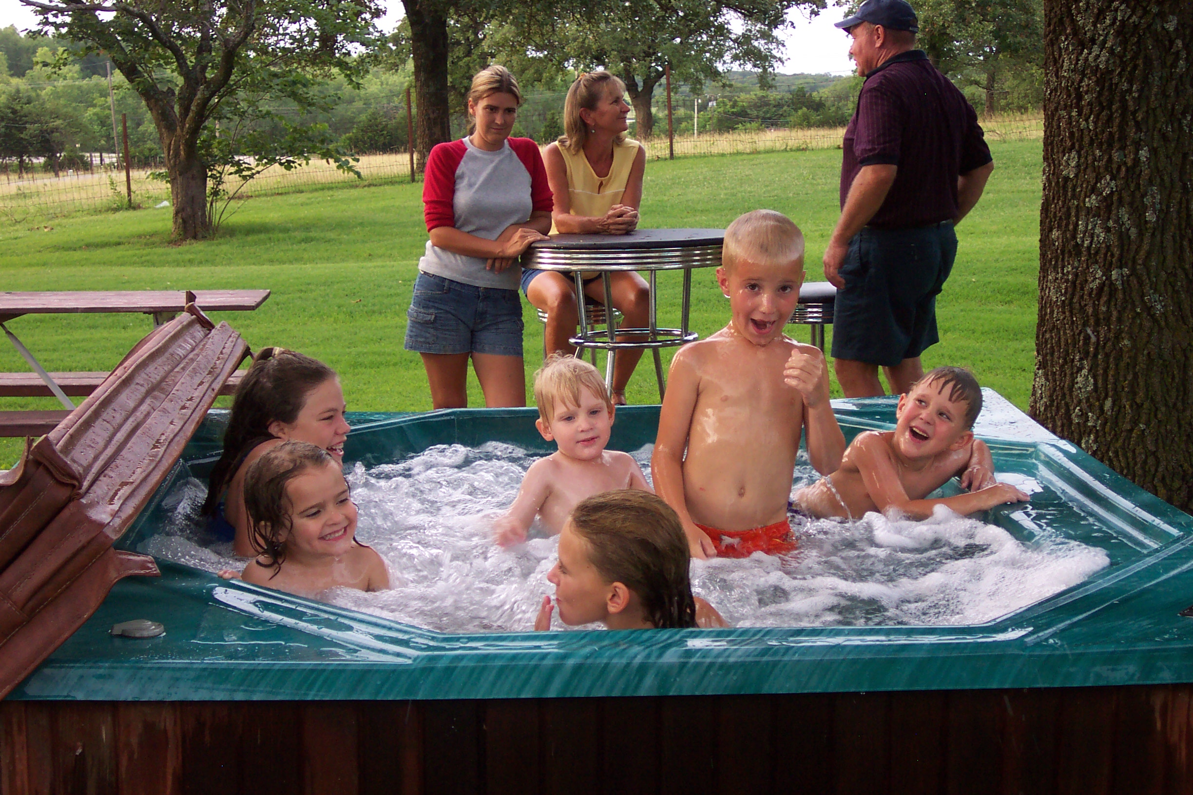 All the kids enjoy the swimming pool.