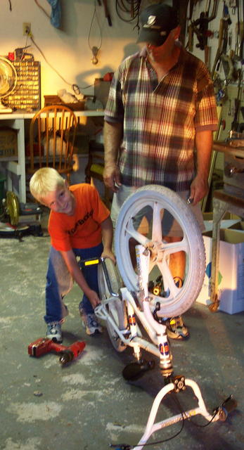 Dakota and Ron have to do a little mechanical work on the bike.