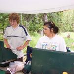 Jackie and Ben prepare supper under the periwing.