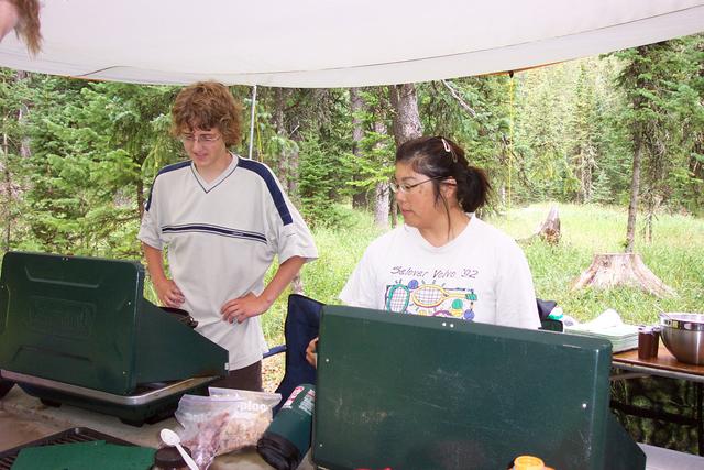 Jackie and Ben prepare supper under the periwing.