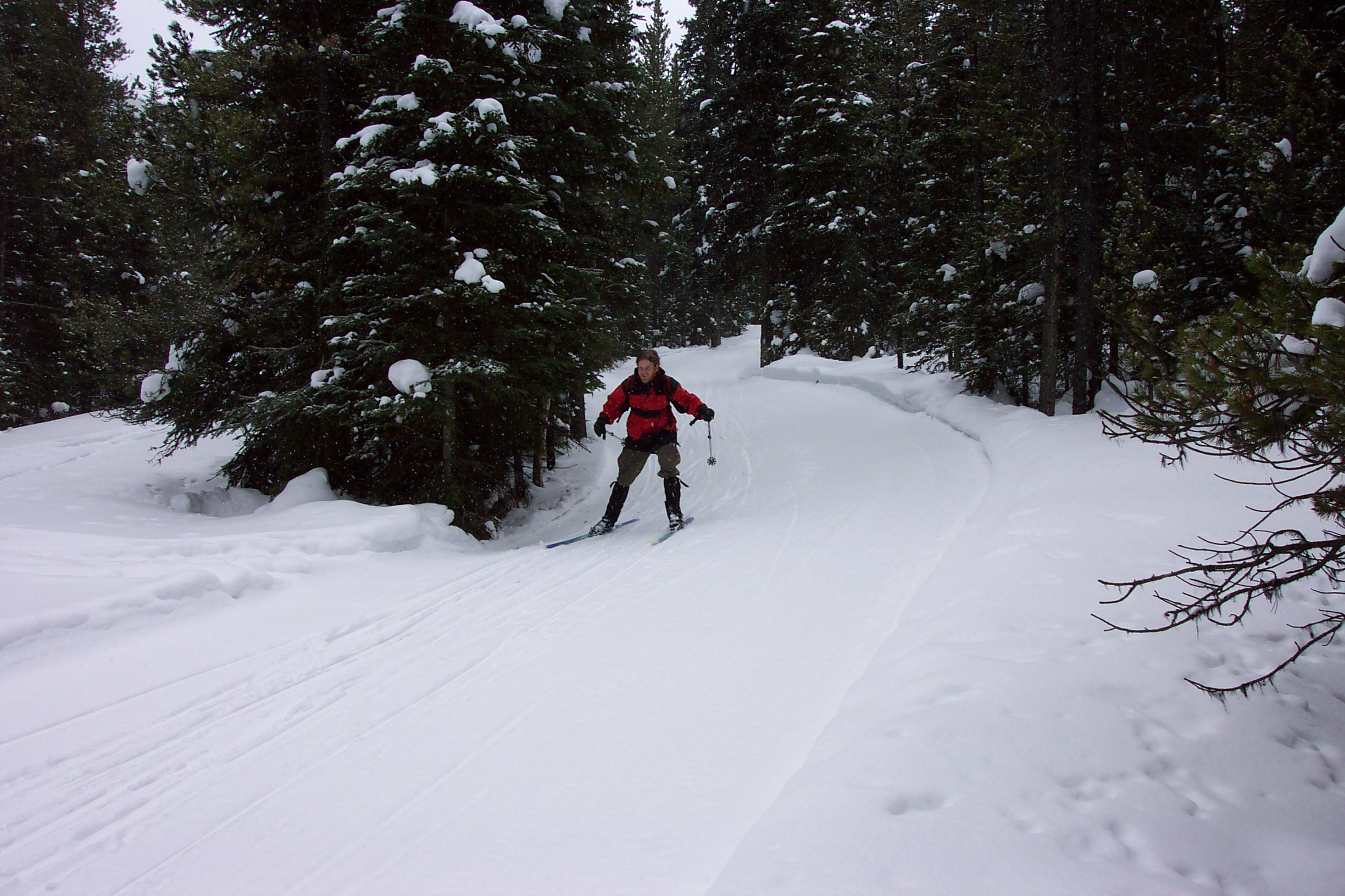 Chris comes screaming around the corner at the bottom of the hill.